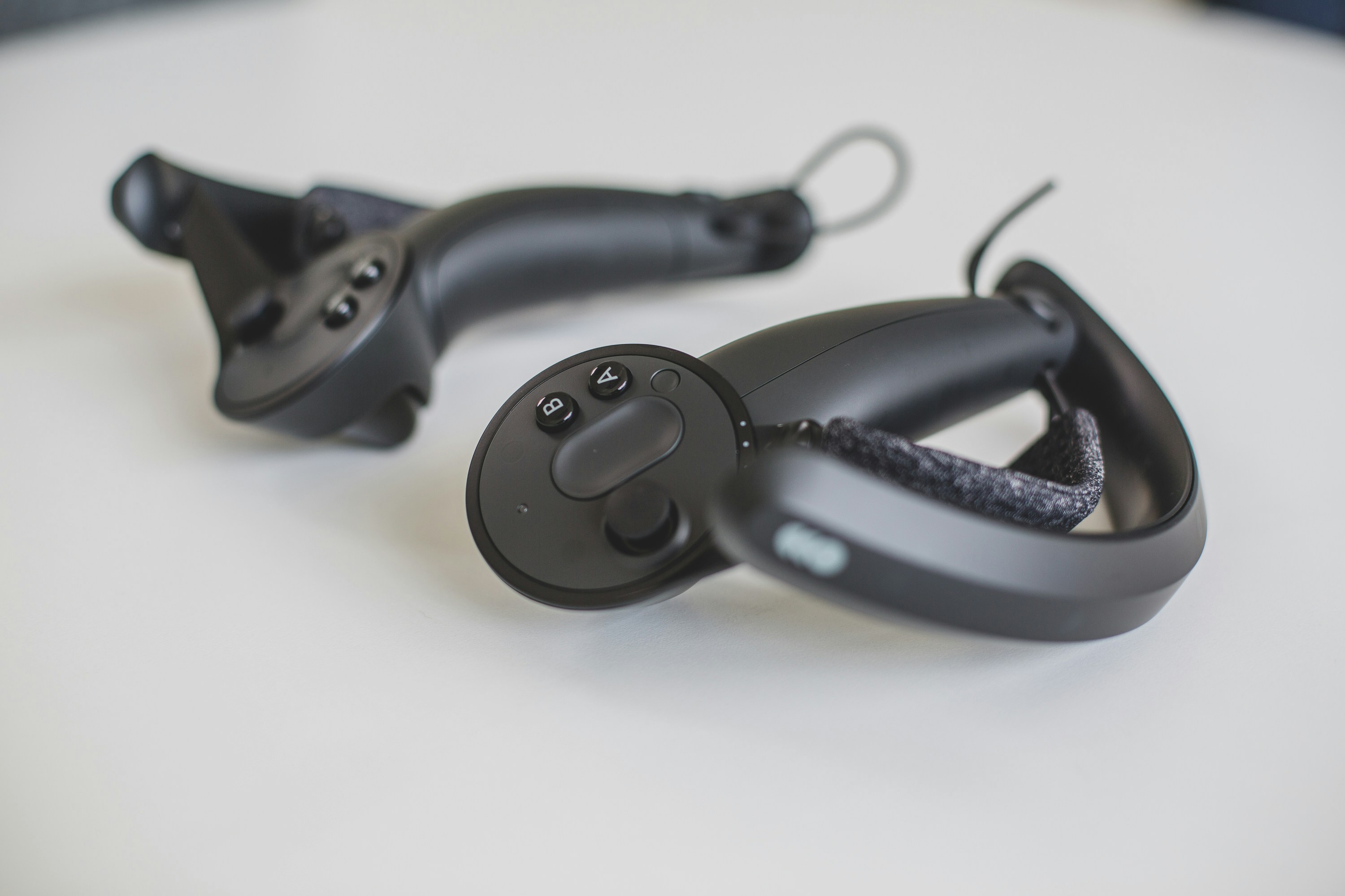 A phone rests on a bear-shaped phone holder.